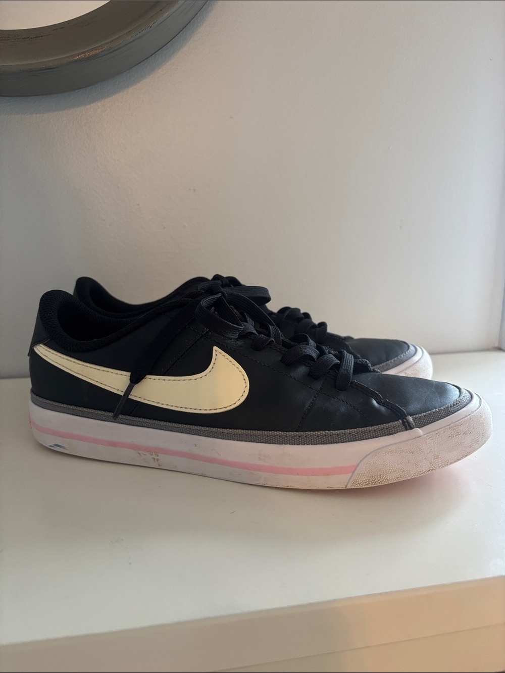 Nike Black Low-Top Sneakers with Cream Swoosh and Pink Accent